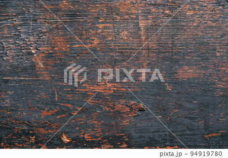Old board. Wooden texture. Dark background. Grunge dirty brown surface of floor with black spots and scratches copy space for text logo. 94919780