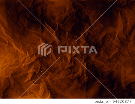 Crumpled paper. Worn texture. Weathered overlay. Crinkled noise on dark orange black rough grunge structure illustration abstract background. Crumpled paper. Worn texture. Weathered overlay. Crinkled noise on dark orange black rough grunge structure illustration abstract background. 94920877