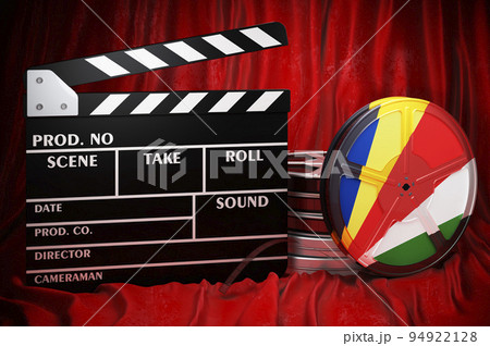 Seychelloise cinematography, film industry, cinema in Seychelles. Clapperboard with and film reels on the red fabric, 3D rendering Seychelloise cinematography, film industry, cinema in Seychelles. Clapperboard with and film reels on the red fabric, 3D rendering 94922128