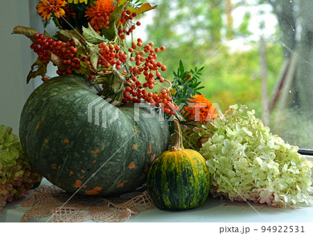 Vintage still life with pumpkins and decorations on the window ceiling inside, thanksgiving day background, fall calendar season concept 94922531