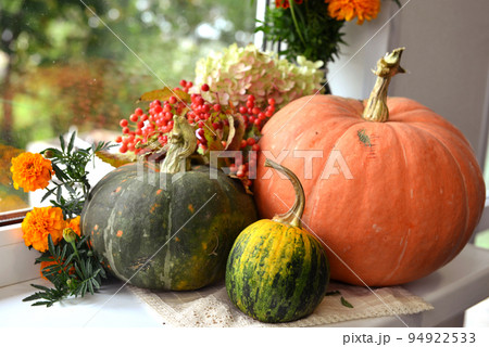 Vintage still life with pumpkins and decorations on the window ceiling inside, thanksgiving day background, fall calendar season concept 94922533