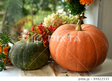 Vintage still life with pumpkins and decorations on the window ceiling inside, thanksgiving day background, fall calendar season concept 94922535