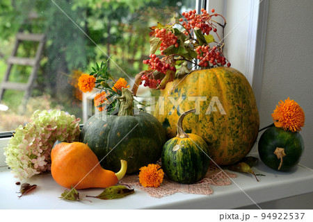 Vintage still life with pumpkins and decorations on the window ceiling inside, thanksgiving day background, fall calendar season concept 94922537