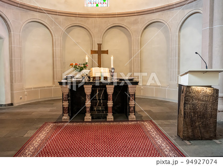 Festive interior decoration with burning candles in temple Church Christianity The ceremony of infant baptism Baptismal 94927074