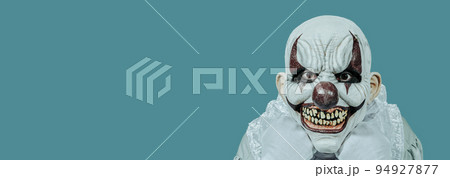 evil clown with a creepy smile, web banner 94927877