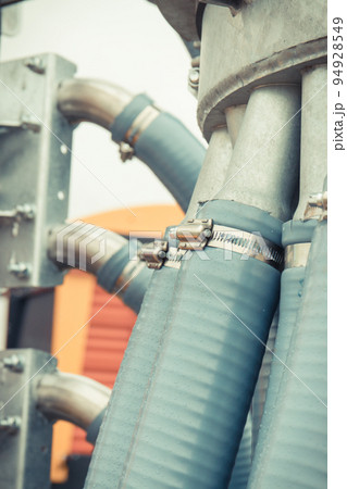Plastic corrugated pipes in agricultural or industrial machine. Technology concept 94928549