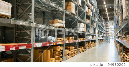 Corridor of a modern large logistics warehouse or store Corridor of a modern large logistics warehouse or store 94930202