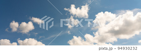 Panoramic background of bright beautiful sky with clouds for design Panoramic background of bright beautiful sky with clouds for design 94930232