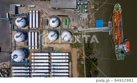 Aerial view white storage tank gas in station LPG gas, LNG or LPG distribution station facility, Oil and gas fuel manufacturing industry. Aerial view white storage tank gas in station LPG gas, LNG or LPG distribution station facility, Oil and gas fuel manufacturing industry. 94932991