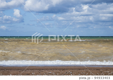 Empty beach landscape with stormy sea water 94933403
