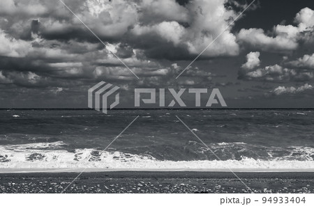 Empty beach view with shore water, monochrome 94933404