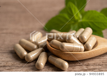 Alternative medicine herbal organic capsule with vitamin E omega 3 fish oil, mineral, drug with herbs leaf natural supplements for healthy good life. 94933895