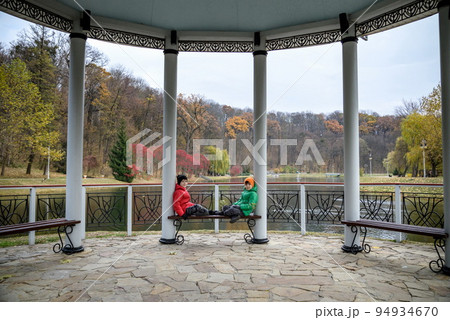 Two siblings stand on the bridge and admire the magnificent view 94934670