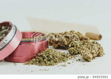 Marijuana buds on white background, close up. Marijuana buds on white background, close up. 94935091