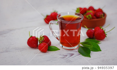Fresh organic strawberries , over dark background Fresh organic strawberries , over dark background 94935397