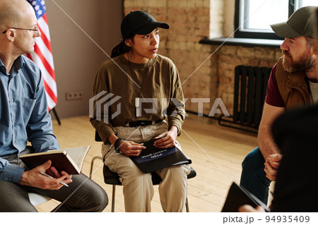 Young Hispanic woman with post traumatic syndrome telling her story 94935409