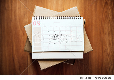 Same Day delivery Ship From Store. Faster Delivery. Many Cardboard boxes and calendar with the date today ready for delivery 94935636