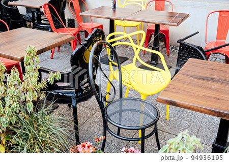 Close street cafe with empty chairs and tables. Closed cafe, small business Closure Crisis 94936195