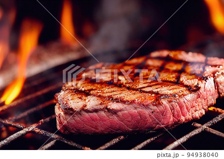 Barbecue steak fried on grill closeup. Red pork meat on grid over burning fire flame. Grilling tenderloin on stove. Barbecued beefsteak portion preparation. Food and cookout 94938040
