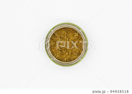 Spices Cumin Zira on a white background. Oriental seasoning for cooking rice and meat pilaf. Aromatic spicy spices for delicious dishes. Dried Whole seeds flowering plant of a fruit Cumin. Isolated Spices Cumin Zira on a white background. Oriental seasoning for cooking rice and meat pilaf. Aromatic spicy spices for delicious dishes. Dried Whole seeds flowering plant of a fruit Cumin. Isolated 94938318