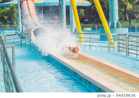 Man having fun at water park. Man having fun at water park. 94939636