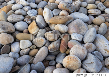 Pebble stone over the seaside 94941184