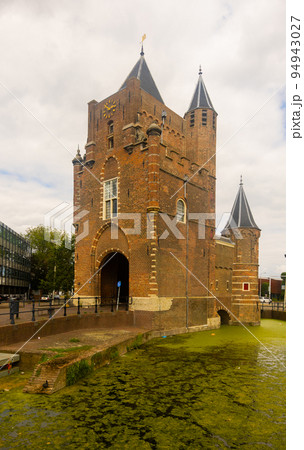 Summer landscape with a view of the Amsterdamse Poort in the of city Haarlem Summer landscape with a view of the Amsterdamse Poort in the of city Haarlem 94943027