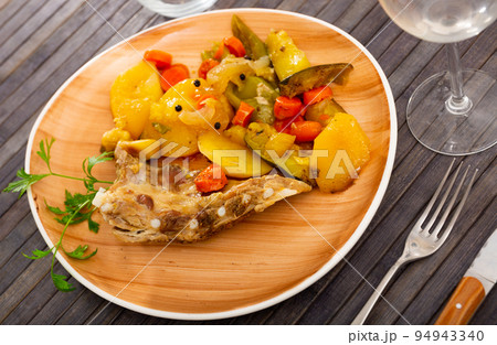 Ribs with vegetables prepared and served on plate Ribs with vegetables prepared and served on plate 94943340