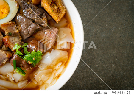 paste of rice flour or boiled Chinese pasta square in clear soup paste of rice flour or boiled Chinese pasta square in clear soup 94943531