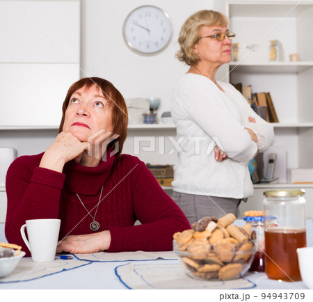 Upset mature woman after discord with female friend 94943709