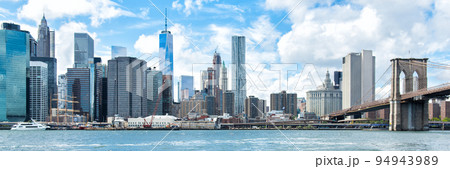 New York City Skyline showing Midtown and Lower Manhattan from the Brooklyn Bridge Park. Iconic New York and famous tourist destination at the waterfront New York City Skyline showing Midtown and Lower Manhattan from the Brooklyn Bridge Park. Iconic New York and famous tourist destination at the waterfront 94943989