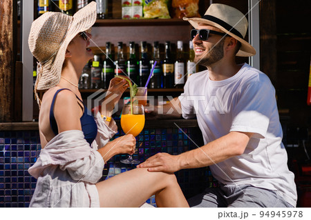Woman and man at date in bar 94945978