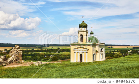 Wonderful church and archeological site in a green field on a warm sunny day Wonderful church and archeological site in a green field on a warm sunny day 94946370
