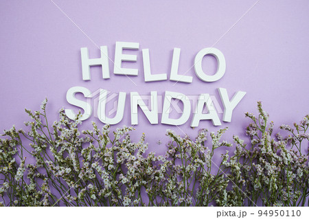 Hello Sunday alphabet letters with flower frame on purple background 94950110