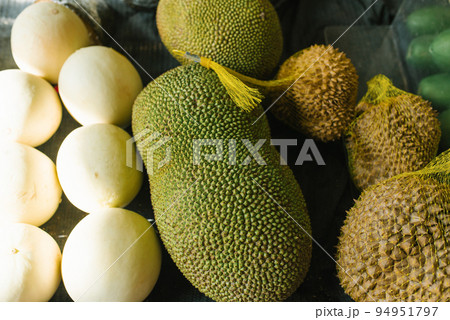 Jack fruit and durian in a shop window 94951797
