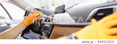 Cleaning ventilation in car with brush and cleaning car 94952910