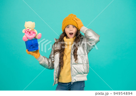 great surprise. happy new year. gift for winter holiday. stylish kid in warm winter clothes. shopping online with extra bonus. small girl surprised about xmas present. gift with love. merry christmas great surprise. happy new year. gift for winter holiday. stylish kid in warm winter clothes. shopping online with extra bonus. small girl surprised about xmas present. gift with love. merry christmas 94954894