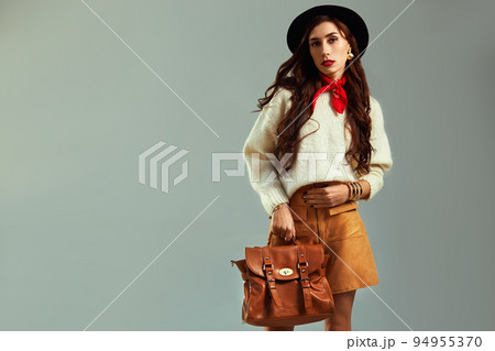 Fashion Model in the studio. Beautiful Sexy Woman In Stylish Fashionable Fall Clothes. Fashion Model in the studio. Beautiful Sexy Woman In Stylish Fashionable Fall Clothes. 94955370