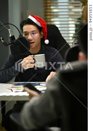 Image of radio host using microphone and laptop to recording podcast in home studio. Radio, podcasts and technology concept Image of radio host using microphone and laptop to recording podcast in home studio. Radio, podcasts and technology concept 94955653