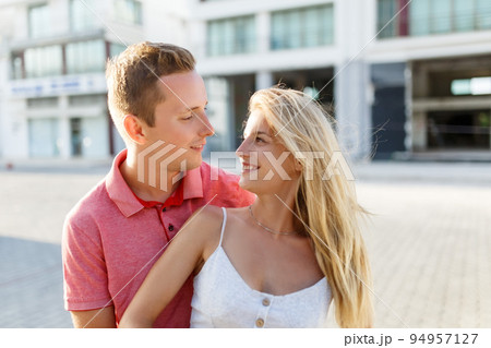 Lovely happy couple.Hugs together and smile in sunset light 94957127