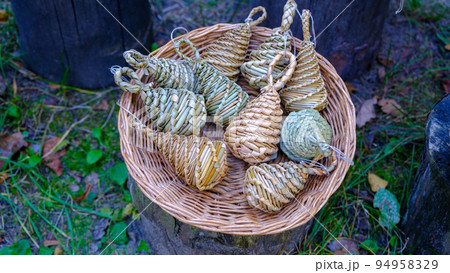 old-time straw-woven toys, home-made handicrafts. for performing rituals. put together a wicker basket 94958329