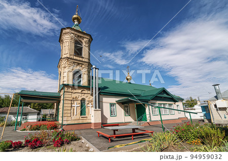 The building of the old brick Old Believers church with a high bell tower 94959032