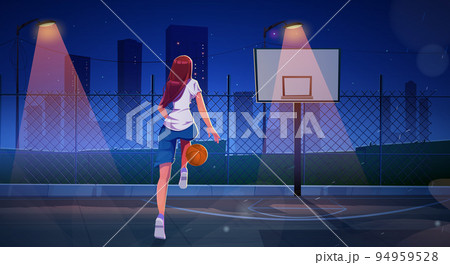 Girl playing basketball on outdoor court at night 94959528