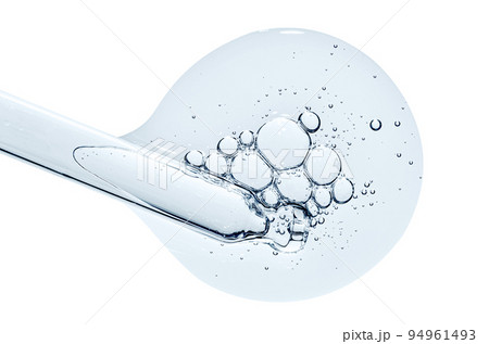 Pipette and a drop of cosmetic serum for the skin. Liquid body care product. Macrophotography. Isolated on a white background. 94961493