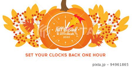 Daylight saving time, 2022 concept. Alarm clock and calendar with the date of November 6 on the pumpkin Daylight saving time, 2022 concept. Alarm clock and calendar with the date of November 6 on the pumpkin 94961865