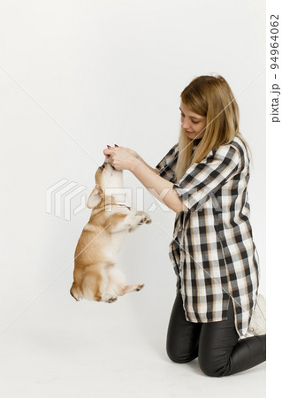 woman pet corgi dog plays teaches commands 94964062