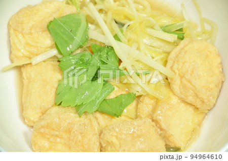 fried white garlic chive with slice yellow egg tofu and chop pork on bowl 94964610