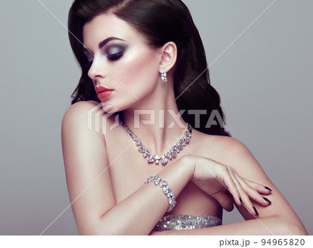 Brunette woman with long shiny wavy hair Brunette woman with long shiny wavy hair 94965820