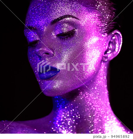 Portrait of beautiful woman with sparkles on her face Portrait of beautiful woman with sparkles on her face 94965892