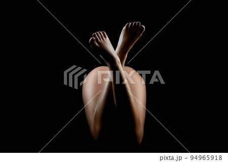 female beautiful Naked legs. girl body silhouette in the dark female beautiful Naked legs. girl body silhouette in the dark 94965918